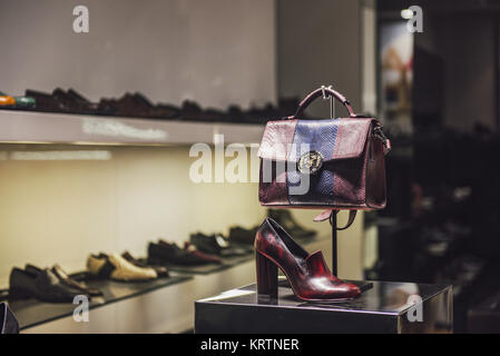 Milan, Italy - November 12, 2016: Shoes and woman purses in a showcase in Milan fashion district. Stock Photo