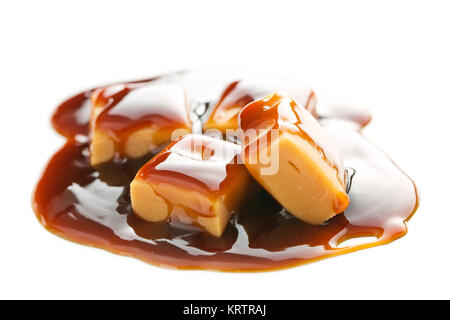 Caramel candies with caramel sauce. Stock Photo