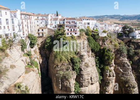 View from the new Bridge over Guadalevin River in Ronda, Malaga, Spain. Popular landmark in the evening Stock Photo