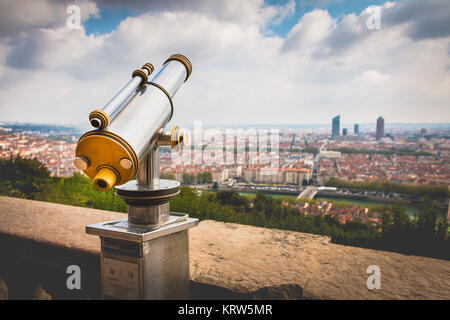 Telescope directed towards the city of Lyon, France Stock Photo