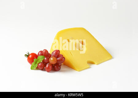 Swiss cheese with red grapes Stock Photo