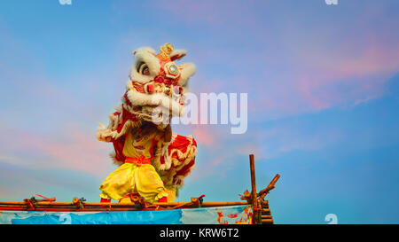 BANGKOK, THAILAND - FEBUARY 20: A group of people perform a lion dance during Chinese new year's celebration Stock Photo