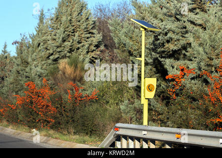A  Self-Standing Emergency Telephone powered by Solar Cells in a motorway in Greece. Stock Photo