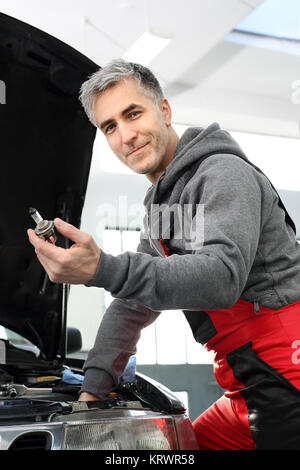 halogen exchange replacing the bulb in the car. Stock Photo