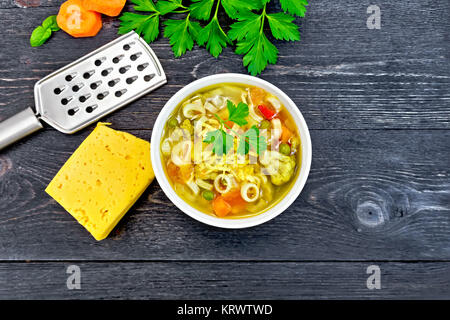 Soup Minestrone in bowl on black board top Stock Photo