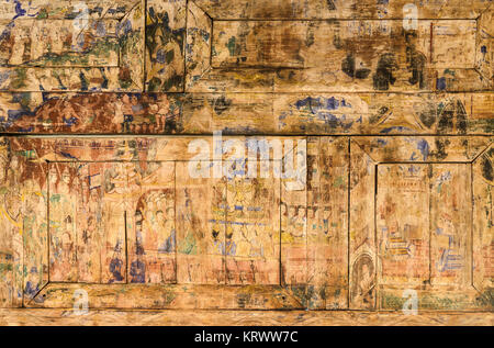 Ancient Thai mural painting on wooden temple wall Stock Photo