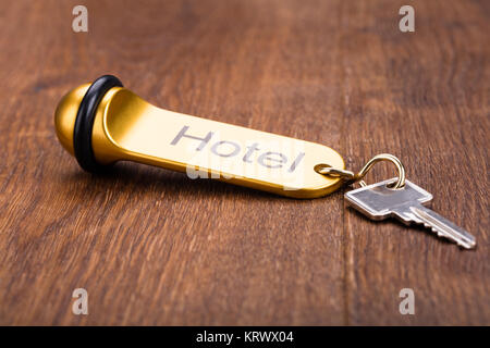 Hotel Key On Wooden Desk Stock Photo