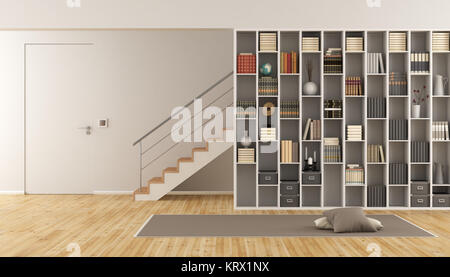 Living room with bookcase and staircase Stock Photo