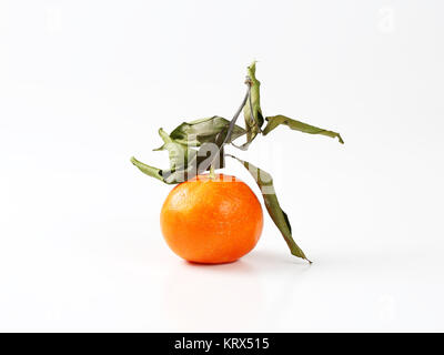 clementine fruit with leaves Stock Photo
