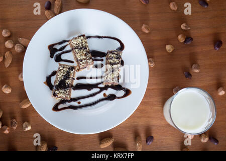 Chocolate cake with walnut cut into squares Stock Photo