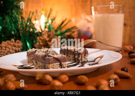 Chocolate cake with walnut cut into squares Stock Photo