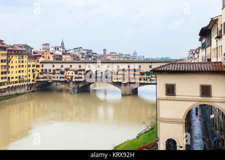 Ponte Vecchio and Arno river in autumn rain Stock Photo
