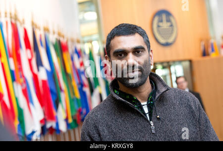 (FILE) · An archive picture, dated 6 April 2013, shows the at the time director of Greenpeace Kumi Naidoo in front of the main hall of the International Tribunal for the Law of the Sea in Hamburg, Germany. Naidoo is going to be from August on the new head of Amnesty International, following the parting secretary general Shetty. Photo: Christian Charisius/dpa Stock Photo