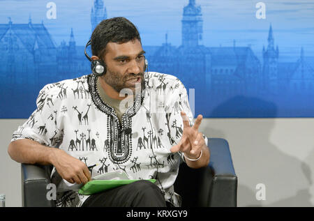 (FILE) · An archive picture, dated 7 Febraury 2015, shows the at the time director of Greenpeace Kumi Naidoo sitting in the 51st security conference in the hotel Bayerischer Hof in Munich, Germany. Naidoo is going to be from August on the new head of Amnesty International, following the parting secretary general Shetty. Photo: Christian Charisius/dpa Stock Photo