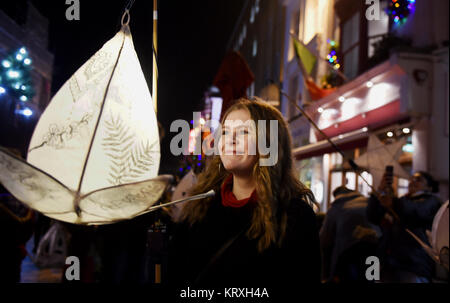 Brighton, UK. 21st Dec, 2017. Thousands take part in the annual Burning the Clocks procession through the streets of Brighton to celebrate the winter solstice . Burning the Clocks is a community event held on the 21st of December created by Same Sky arts group to mark the shortest day of the year. Local people make their own paper and willow lanterns which they parade through the city before being put on a bonfire on the beach. Credit: Simon Dack/Alamy Live News Stock Photo