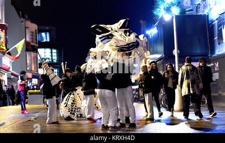 Brighton, UK. 21st Dec, 2017. Thousands take part in the annual Burning the Clocks procession through the streets of Brighton to celebrate the winter solstice . Burning the Clocks is a community event held on the 21st of December created by Same Sky arts group to mark the shortest day of the year. Local people make their own paper and willow lanterns which they parade through the city before being put on a bonfire on the beach. Credit: Simon Dack/Alamy Live News Stock Photo