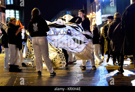 Brighton, UK. 21st Dec, 2017. Thousands take part in the annual Burning the Clocks procession through the streets of Brighton to celebrate the winter solstice . Burning the Clocks is a community event held on the 21st of December created by Same Sky arts group to mark the shortest day of the year. Local people make their own paper and willow lanterns which they parade through the city before being put on a bonfire on the beach. Credit: Simon Dack/Alamy Live News Stock Photo