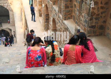 People visit Ugrasen Ki Baoli in New Delhi India. Ugrasen Ki Baoli is a historical step well protected by Archaeological Survey of India. Stock Photo