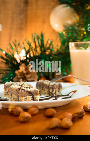 Chocolate cake with walnut cut into squares Stock Photo