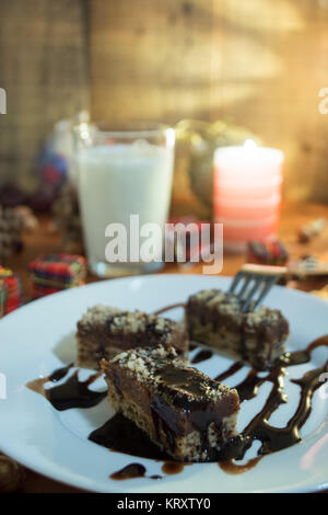 Chocolate cake with walnut cut into squares Stock Photo
