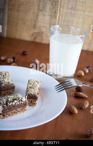 Chocolate cake with walnut cut into squares Stock Photo
