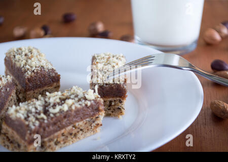 Chocolate cake with walnut cut into squares Stock Photo