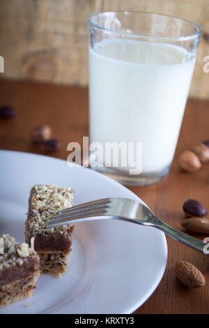 Chocolate cake with walnut cut into squares Stock Photo