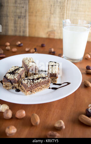 Chocolate cake with walnut cut into squares Stock Photo