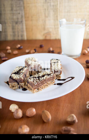 Chocolate cake with walnut cut into squares Stock Photo