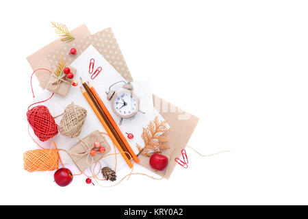 Autumn background with pencils, envelopes and an alarm clock. Top view. Space for your text. Stock Photo