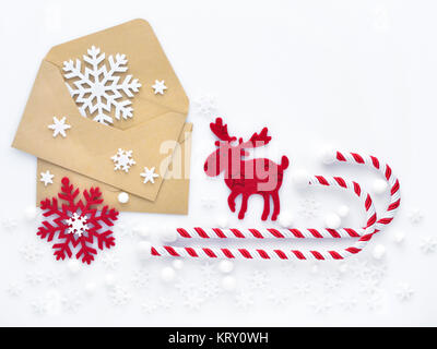 Christmas composition. Envelopes, christmas decorations, snowflakes on white background. Top view. Stock Photo