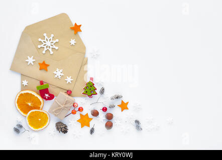 Christmas, happy new year composition. Christmas gifts, envelopes, christmas decorations, snowflakes on white background. Top view. Stock Photo