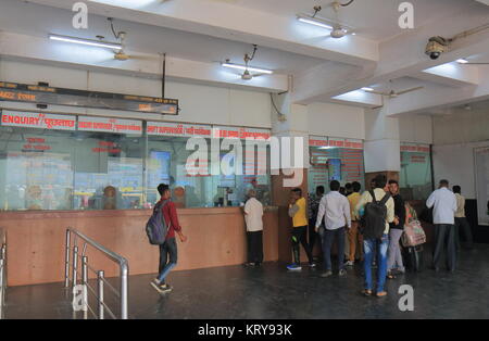 People queue to buy tickets at New Delhi train station in New Delhi India Stock Photo