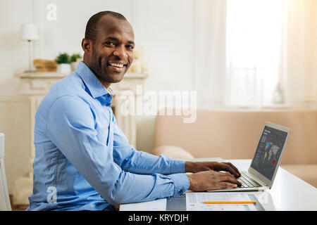 Alert man enjoying his work from home Stock Photo