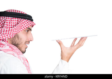 Young muslim man holding something. Perfect for displaying your poroduct. isolated. Stock Photo