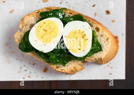 Crostini with Spinach and Quail Egg Stock Photo