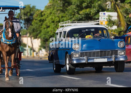 american blue chevrolet classic car with white top rides on the street in varadero cuba - serie cuba 2016 reportage Stock Photo