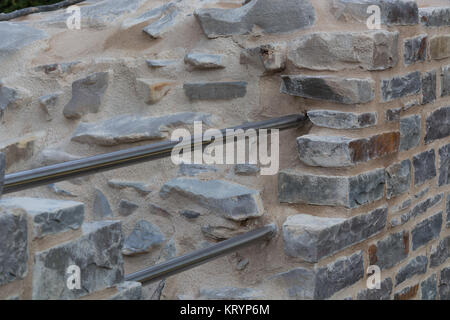 old stone wall with old patterns on hardenberg castle Stock Photo