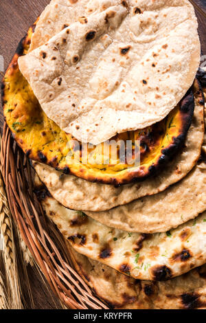 Assorted Indian Bread Basket includes chapati, tandoori roti or naan, paratha, kulcha, fulka, missi roti Stock Photo