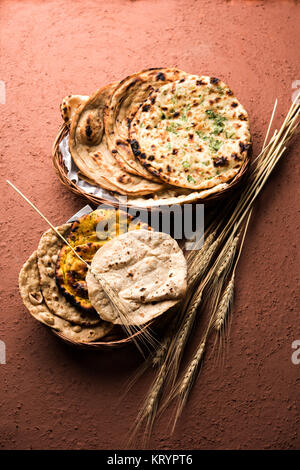 Assorted Indian Bread Basket includes chapati, tandoori roti or naan, paratha, kulcha, fulka, missi roti Stock Photo