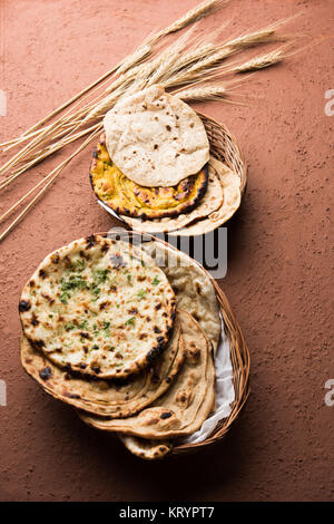 Assorted Indian Bread Basket includes chapati, tandoori roti or naan, paratha, kulcha, fulka, missi roti Stock Photo