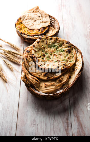 Assorted Indian Bread Basket includes chapati, tandoori roti or naan, paratha, kulcha, fulka, missi roti Stock Photo