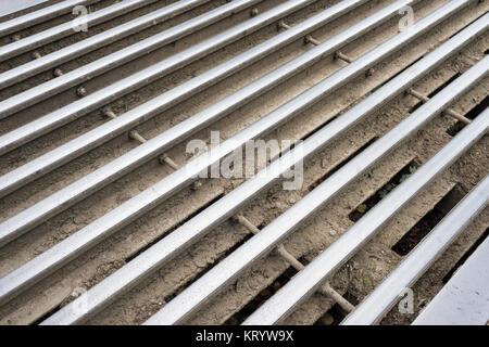 Close up of the cattle grid on the road Stock Photo