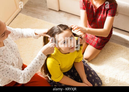 Girlfriends doing hairstyle Stock Photo