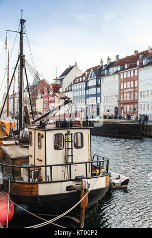 Ships moored in Nyhavn, 17th-century waterfront, canal and popular touristic district in Copenhagen, Denmark Stock Photo