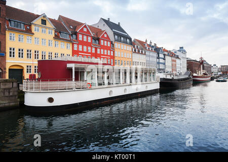 Old ships moored in Nyhavn, 17th-century waterfront, canal and popular touristic district in Copenhagen, Denmark Stock Photo