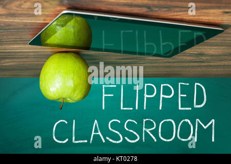 Didital tablet and apple on the desk Stock Photo