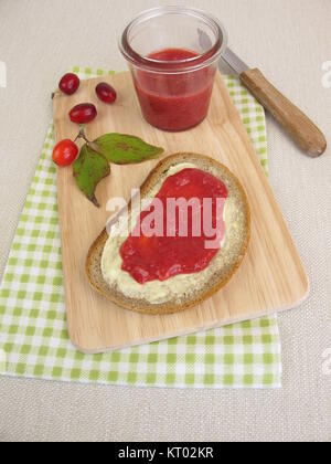 Butterbread with cornel cherry jam for breakfast Stock Photo
