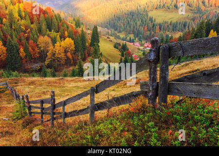 Colorful autumn landscape scene with fence in Transylvania Stock Photo