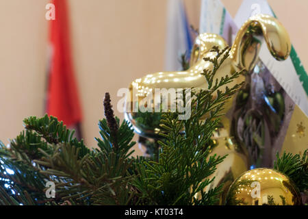 Christmas tree fir and cork from champagne and gold dog Stock Photo